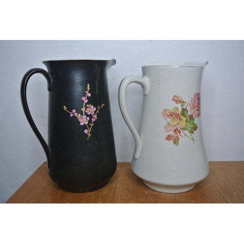 303 - Two antique hand painted jugs