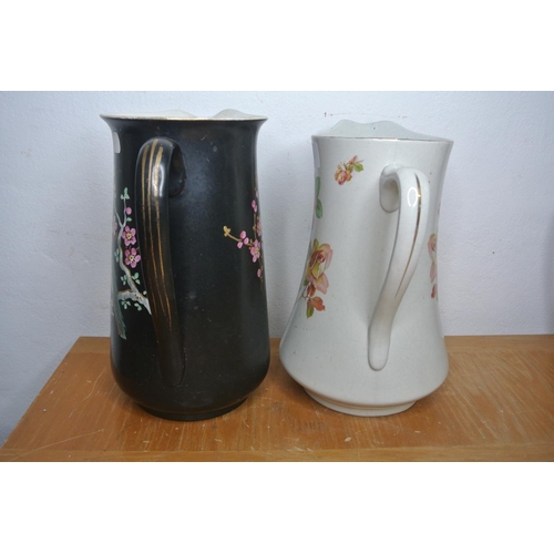 303 - Two antique hand painted jugs