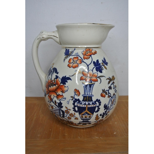 304 - An antique hand painted jug produced by Wallis Gimson and co