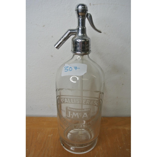 307 - A vintage glass soda syphon with 'J.McAlister and sons Ballymena' etched on the glass