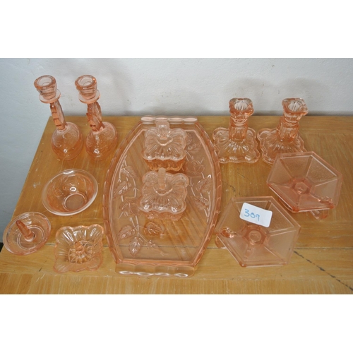 309 - A vintage pink pressed glass dressing table vanity set.