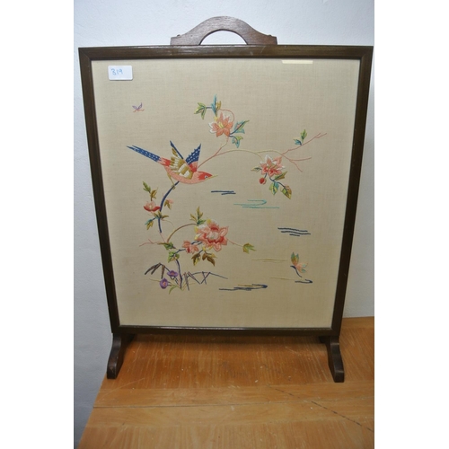 319 - A stunning antique fire screen with hand stitched tapestry depicting a bird and flowers