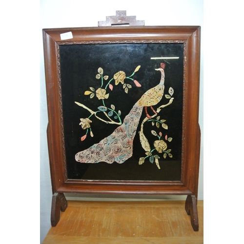 320 - A stunning antique fire screen with hand painted peacock