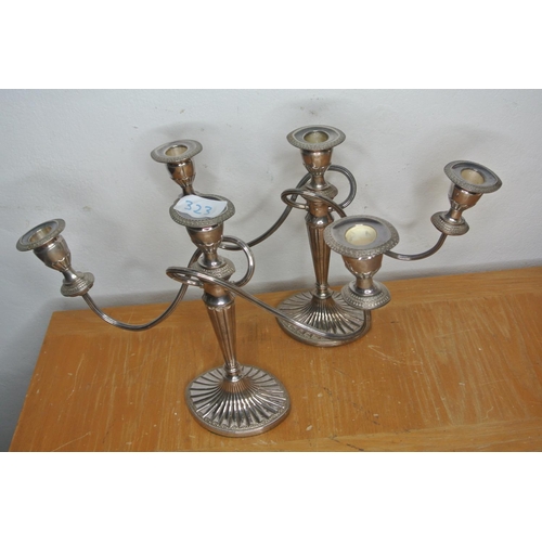 323 - A pair of antique style silver plated double twisted candelabras.