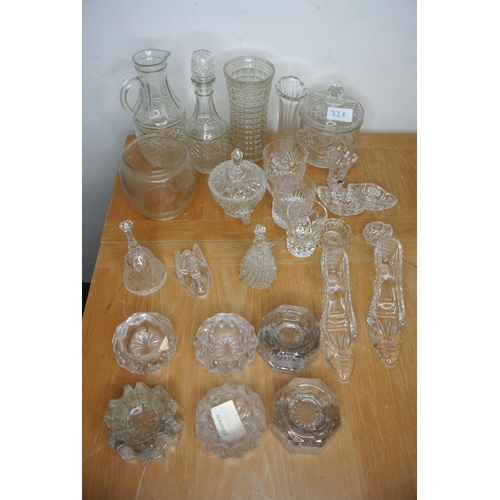 328 - A large collection of cut glass and crystal items to include jugs, decanters, lidded pots and more