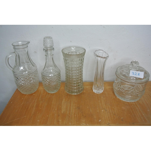 328 - A large collection of cut glass and crystal items to include jugs, decanters, lidded pots and more