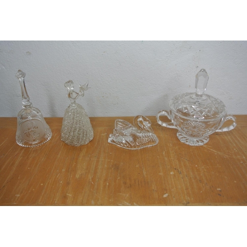 328 - A large collection of cut glass and crystal items to include jugs, decanters, lidded pots and more