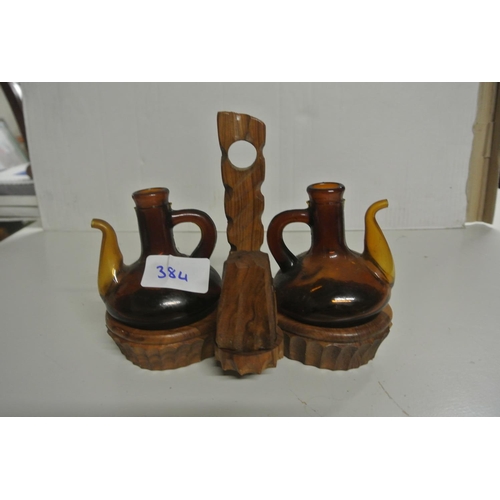 384 - A vintage wooden condiment holder or cruet set, missing one salt seller