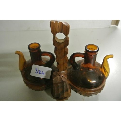 384 - A vintage wooden condiment holder or cruet set, missing one salt seller