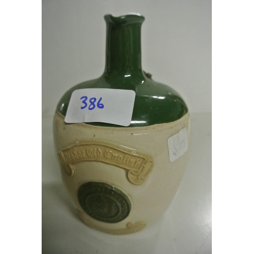 386 - A antique stoneware bottle reading 'Eau de Cologne'