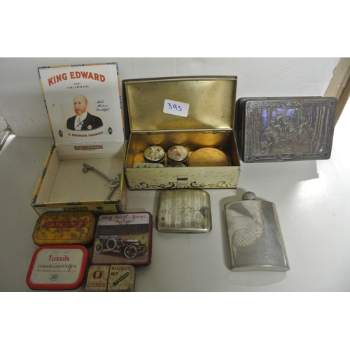 395 - A large collection of various items to include cigarette and cigar boxs, vintage tins, coins and mor... 