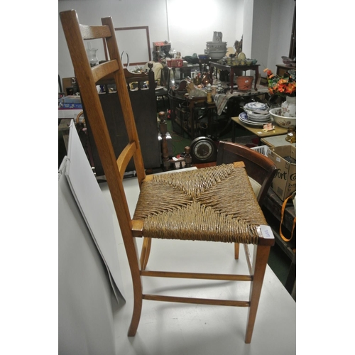 402 - An antique bedroom chair with woven seat