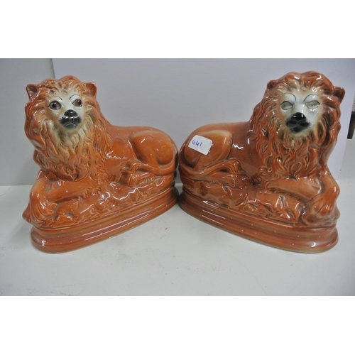 441 - An antique pair of Staffordshire mantle lions (one lion is missing its eyes)