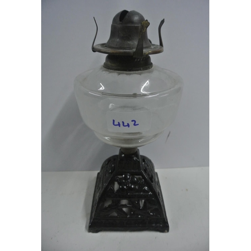 442 - A vintage oil lamp reservoir on cast iron base, 'Young's Comet Burner'