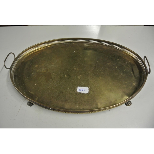 461 - A large antique brass serving tray on on claw feet