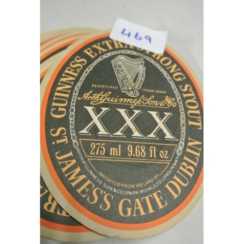 469 - A large collection of vintage Guinness Triple X promotional coasters