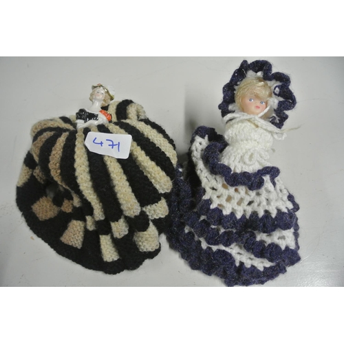 471 - A vintage tea cosy in the form of a lady, along with a vintage doll