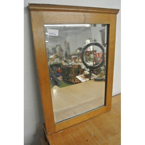 474 - An antique wood framed mirror