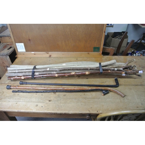 92 - An assortment of handcrafted walking sticks