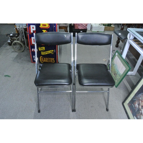 99 - A pair of metal framed folding chairs