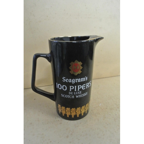 352 - A vintage Seagram's 100 Pipers Deluxe Scotch Whisky Pub advertising jug.