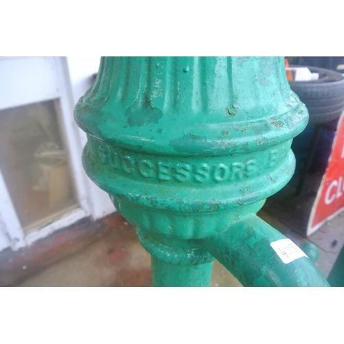 475 - An antique cast iron cow tail pump painted green, reading 'SUCCESSORS BALLYMENA'