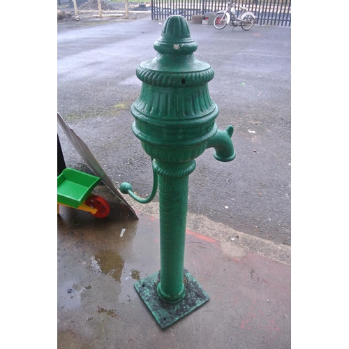 476 - A scarce antique cast iron cow tail pump painted green, reading 'WILSON GLASS DUNGANNON'