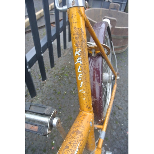 502 - A vintage Raleigh bicycle with carbide lamp.