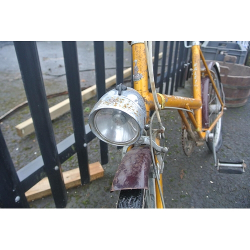 502 - A vintage Raleigh bicycle with carbide lamp.