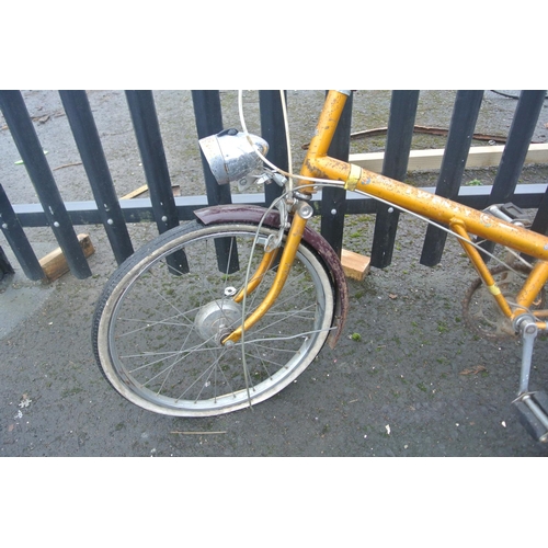 502 - A vintage Raleigh bicycle with carbide lamp.