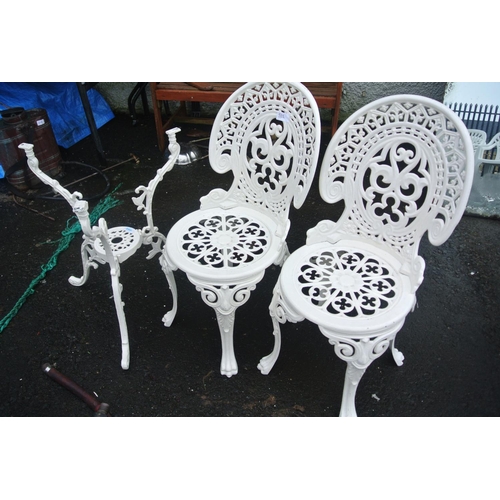 511 - A pair of metal garden chairs with matching table base.