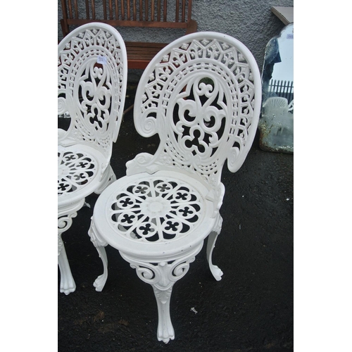 511 - A pair of metal garden chairs with matching table base.