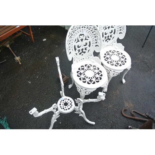 511 - A pair of metal garden chairs with matching table base.