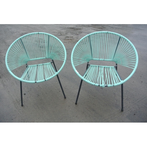 513 - Two modern woven garden chairs.