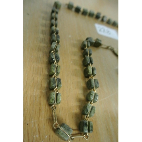 228 - A set of unusual Connemara marble rosary beads.