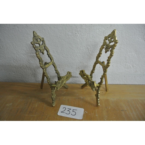 235 - A pair of miniature brass table top easels.