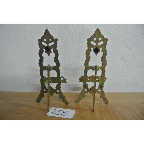 235 - A pair of miniature brass table top easels.