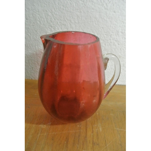 393 - A collection of antique and vintage ruby glass, to include a two stunning jugs and more (some a/f)