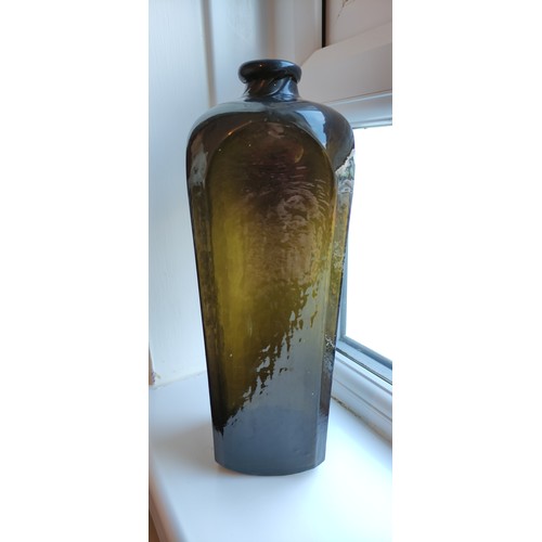 197a - An 1860's sealed & embossed Gin bottle. 10.75ins tall. Mid green, square body tapers out, pig snout ... 