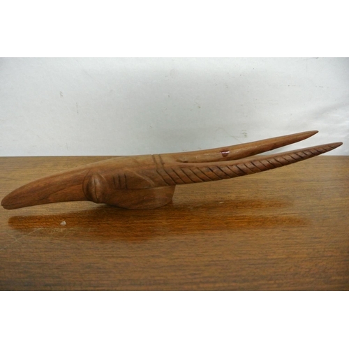 103 - A vintage pair of beautifully craved wooden models of African antelope heads.