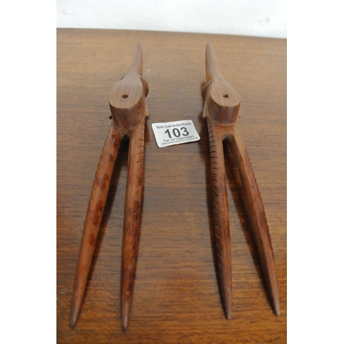 103 - A vintage pair of beautifully craved wooden models of African antelope heads.