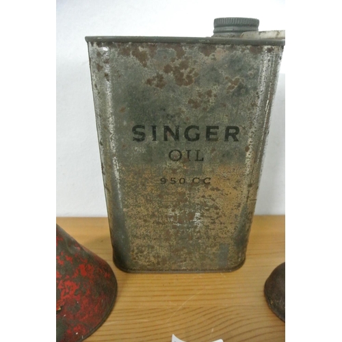 19 - Three vintage/antique oil cans to include Singer and more.