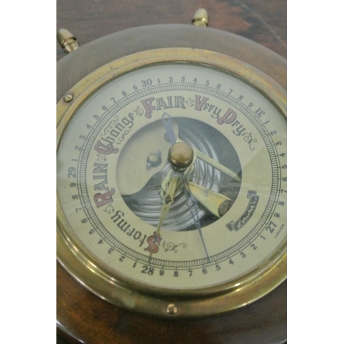 29 - A retro ship's wheel barometer produced by 'Lorioten'.