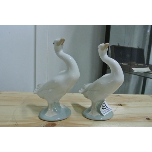 403 - A pair of Lladro ducks.