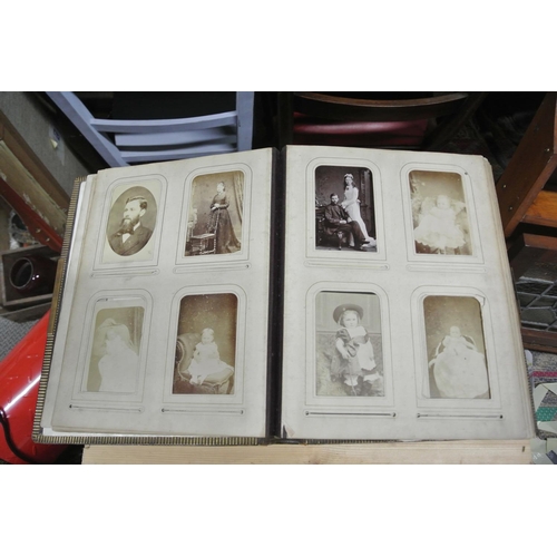 410 - An antique/ Victorian photo album with contents.