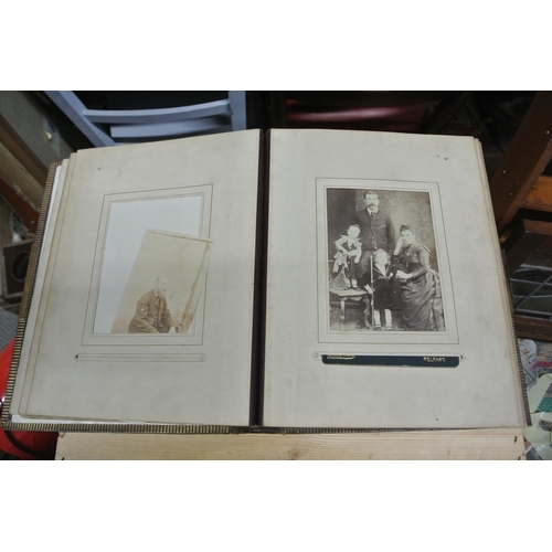 410 - An antique/ Victorian photo album with contents.