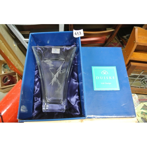 413 - A boxed Duiske crystal vase with decorative design.