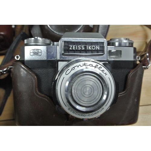 415 - 2 vintage Zeiss Ikon cameras in leather cases.