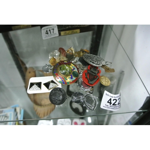 422 - An assortment of various items to include Military buttons, fobs etc.