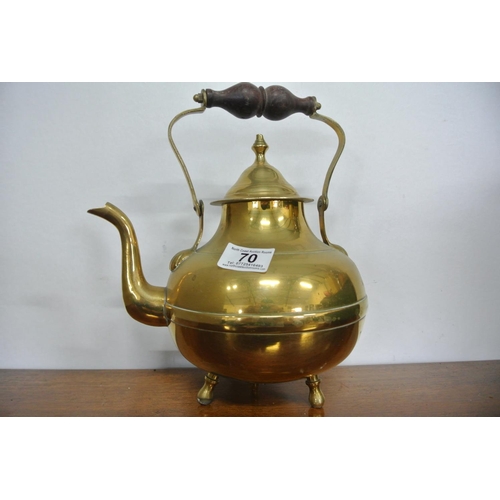 70 - An antique brass teapot along with a retro Picquot Ware teapot.